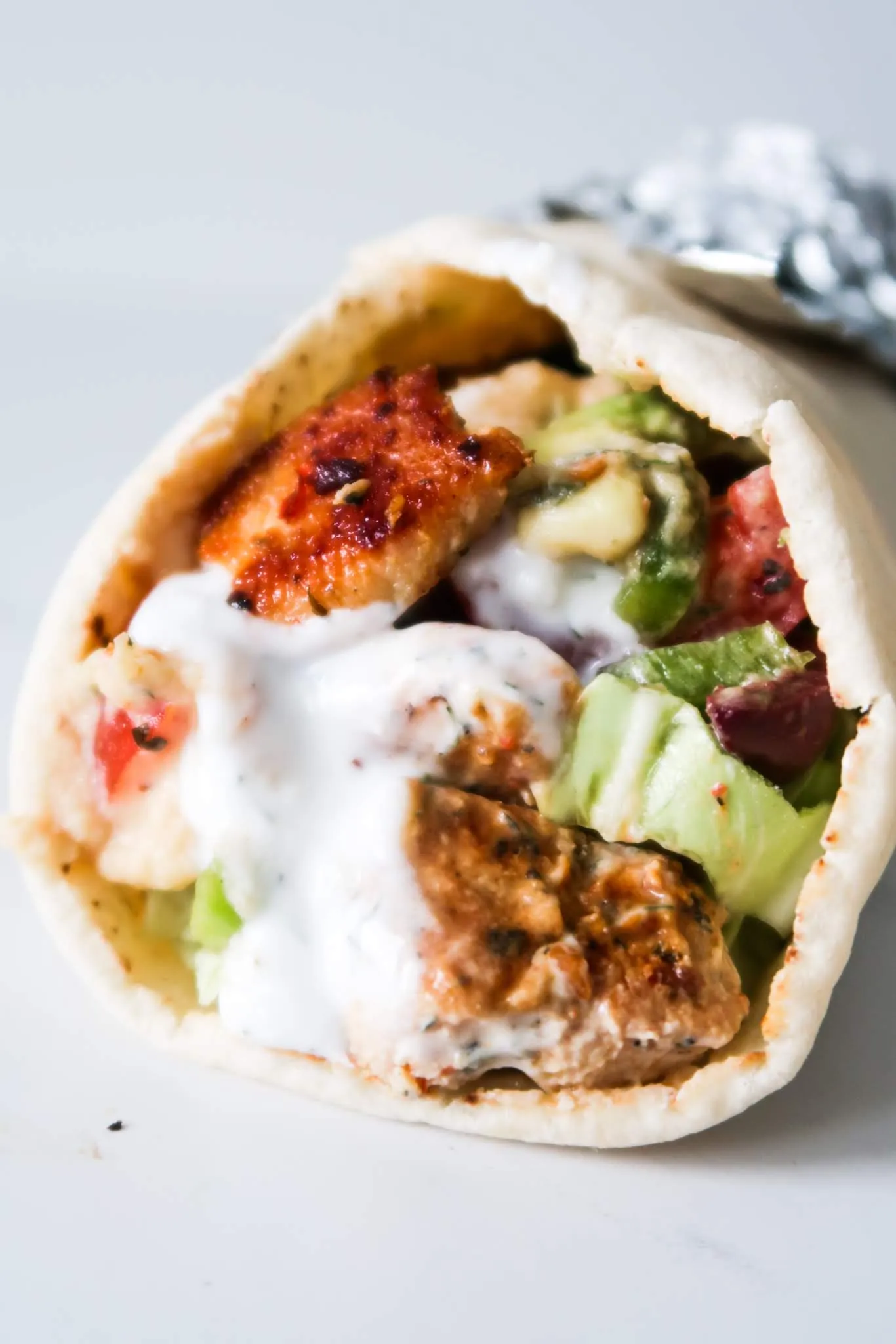 Mediterranean Chicken Wraps with Hummus and Garlicky Yogurt Sauce