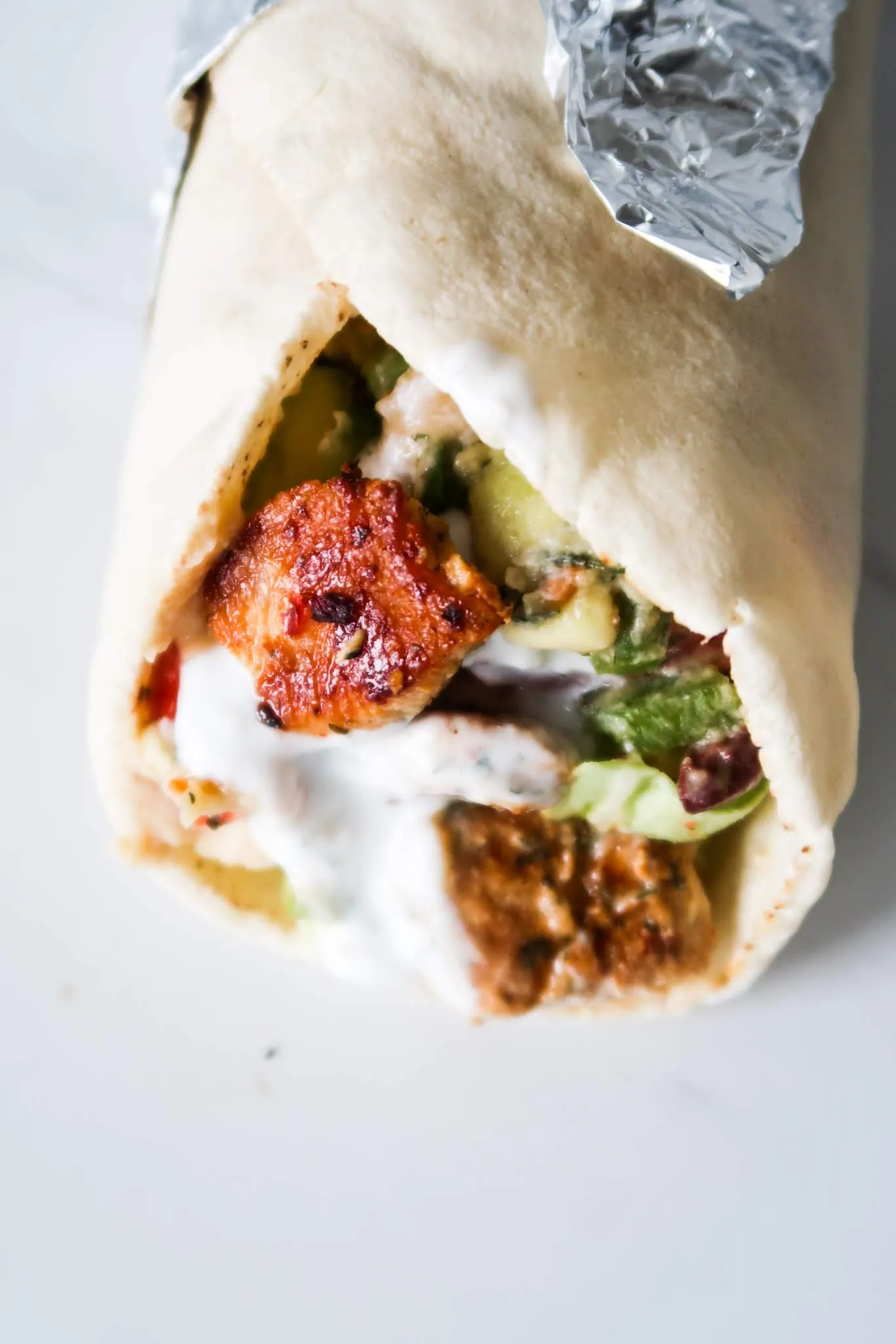 Mediterranean Chicken Wraps with Hummus and Garlicky Yogurt Sauce