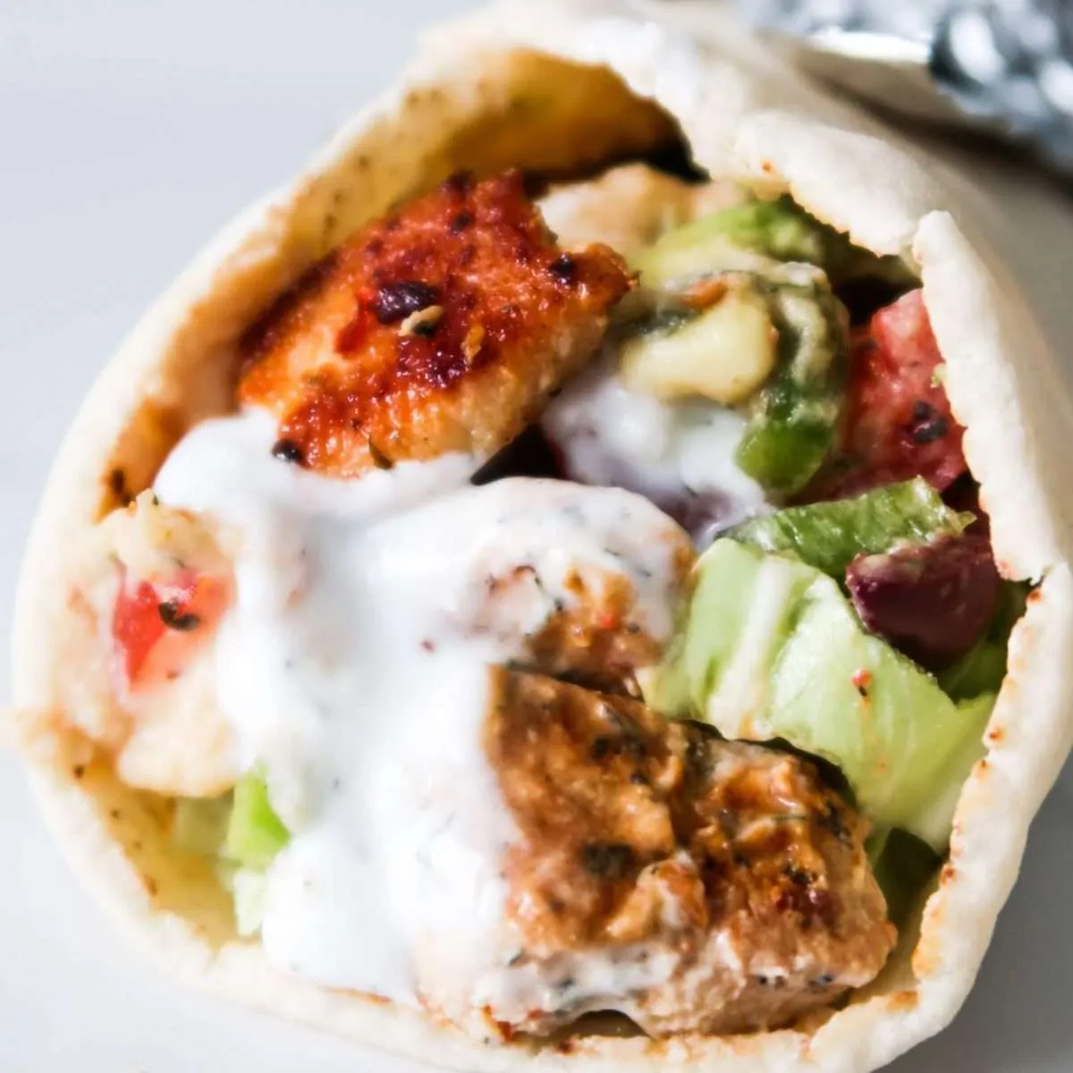 Mediterranean Chicken Wraps with Hummus and Garlicky Yogurt Sauce
